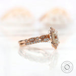 Side view of Art Deco Moissanite halo ring in rose gold
