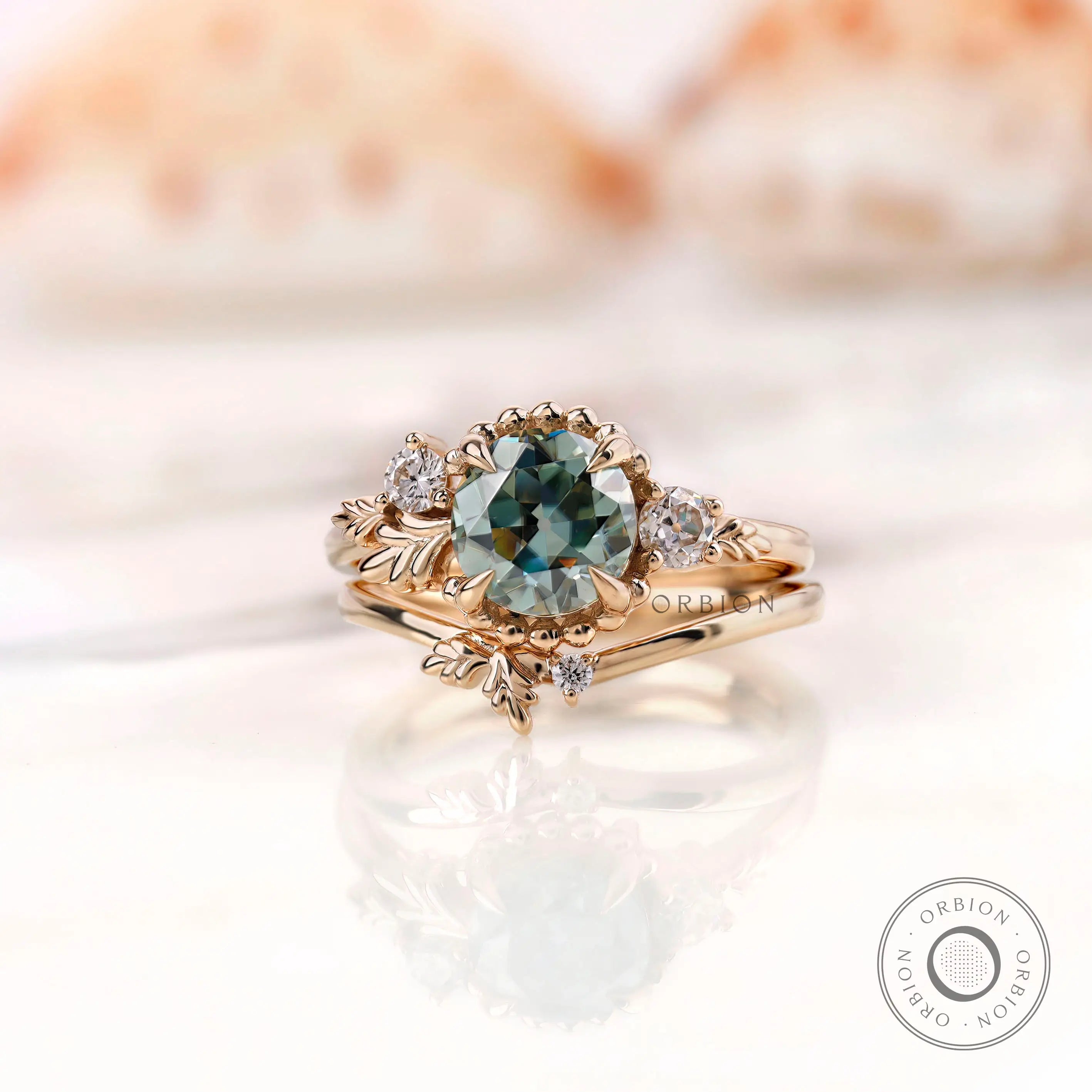 Front view nature inspired blue green moissanite ring set