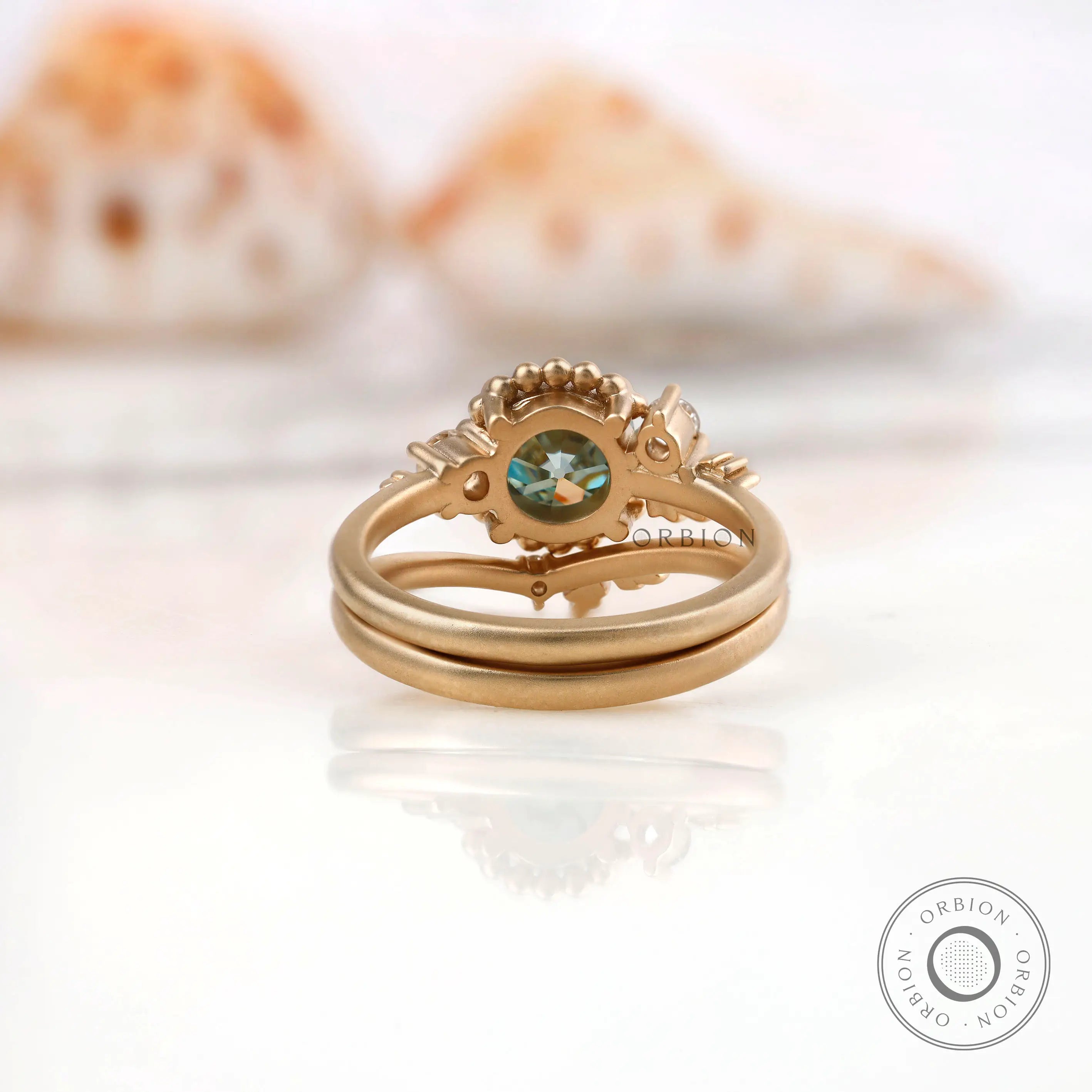 Back view highlighting the detailed leaf motif around Moissanite stone.