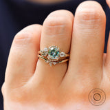 On hand view nature inspired blue green moissanite ring