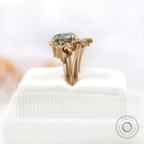 OEC Blue Green Moissanite ring showcasing side view on soft ring box.