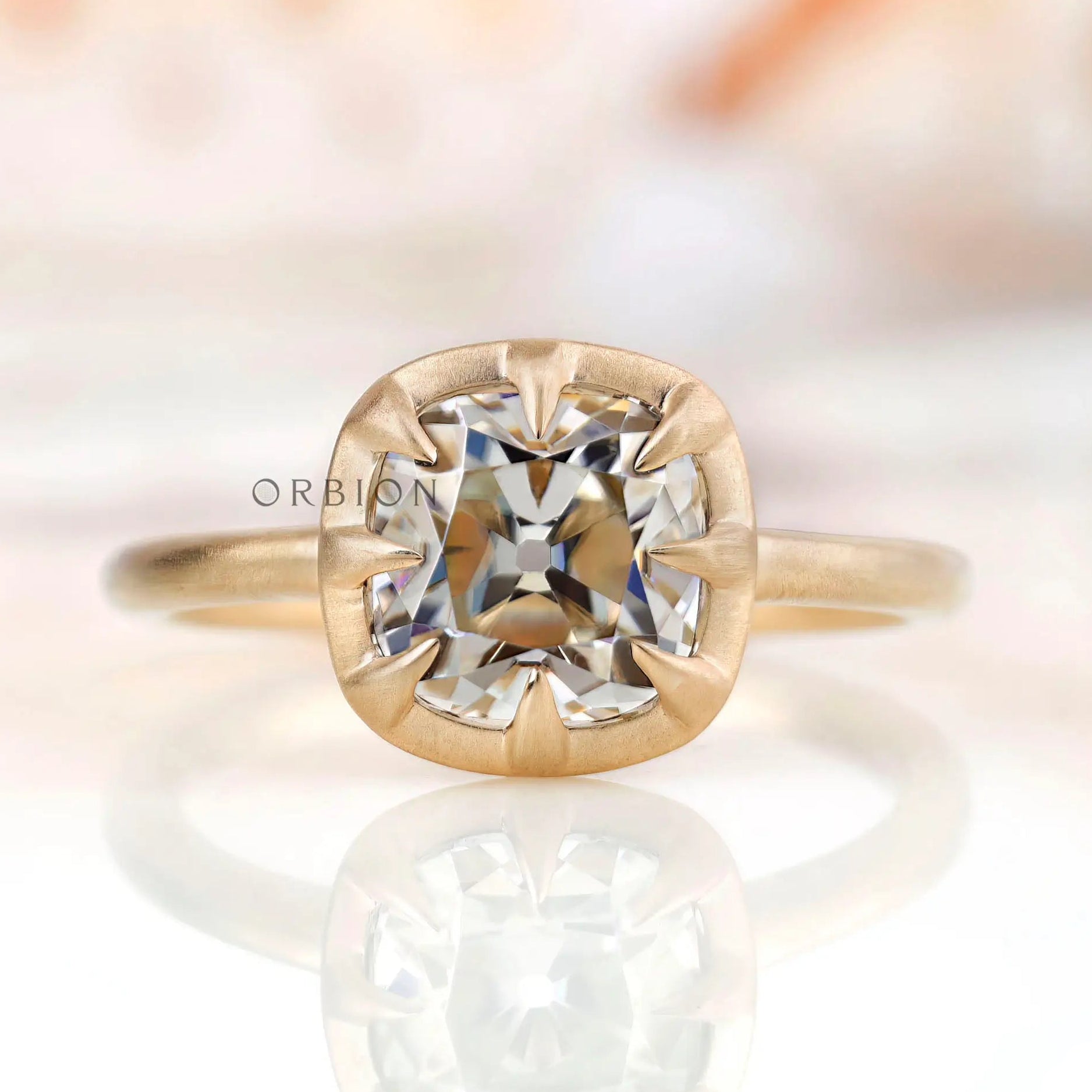 Elegant square cushion Old Mine Cut GHI moissanite solitaire bezel set engagement ring in 10K yellow gold.
