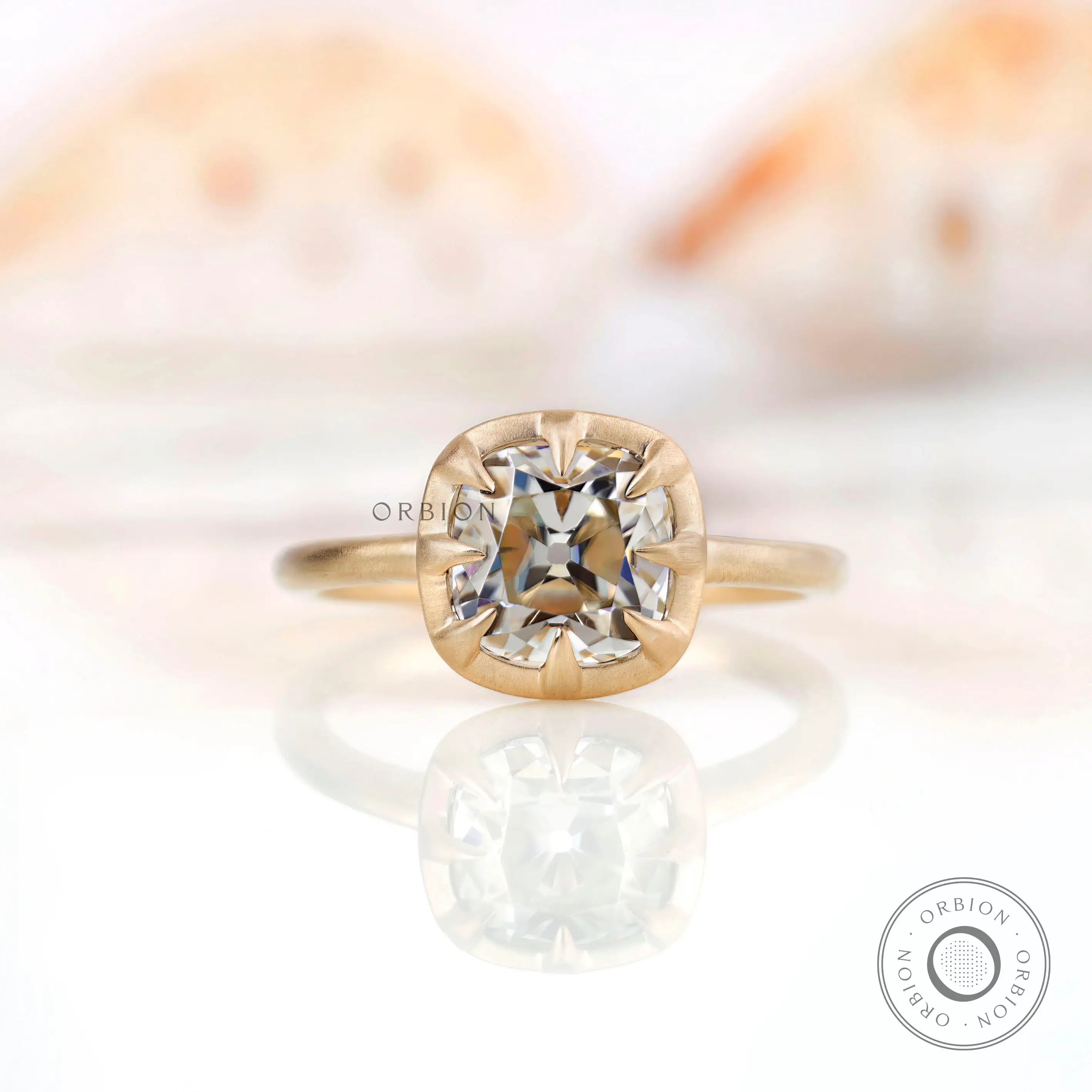 Elegant square cushion Old Mine Cut GHI moissanite solitaire bezel set engagement ring in 10K yellow gold.