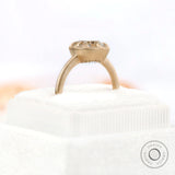 Square cushion Old Mine Cut GHI moissanite solitaire bezel set engagement ring in yellow gold.
