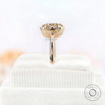 Profile view of yellow gold solitaire moissanite ring