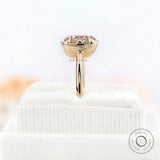 Profile view of yellow gold solitaire moissanite ring