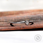 Side profile oval dainty engagement ring