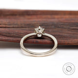 Rear gallery view of prong set elongated round diamond ring