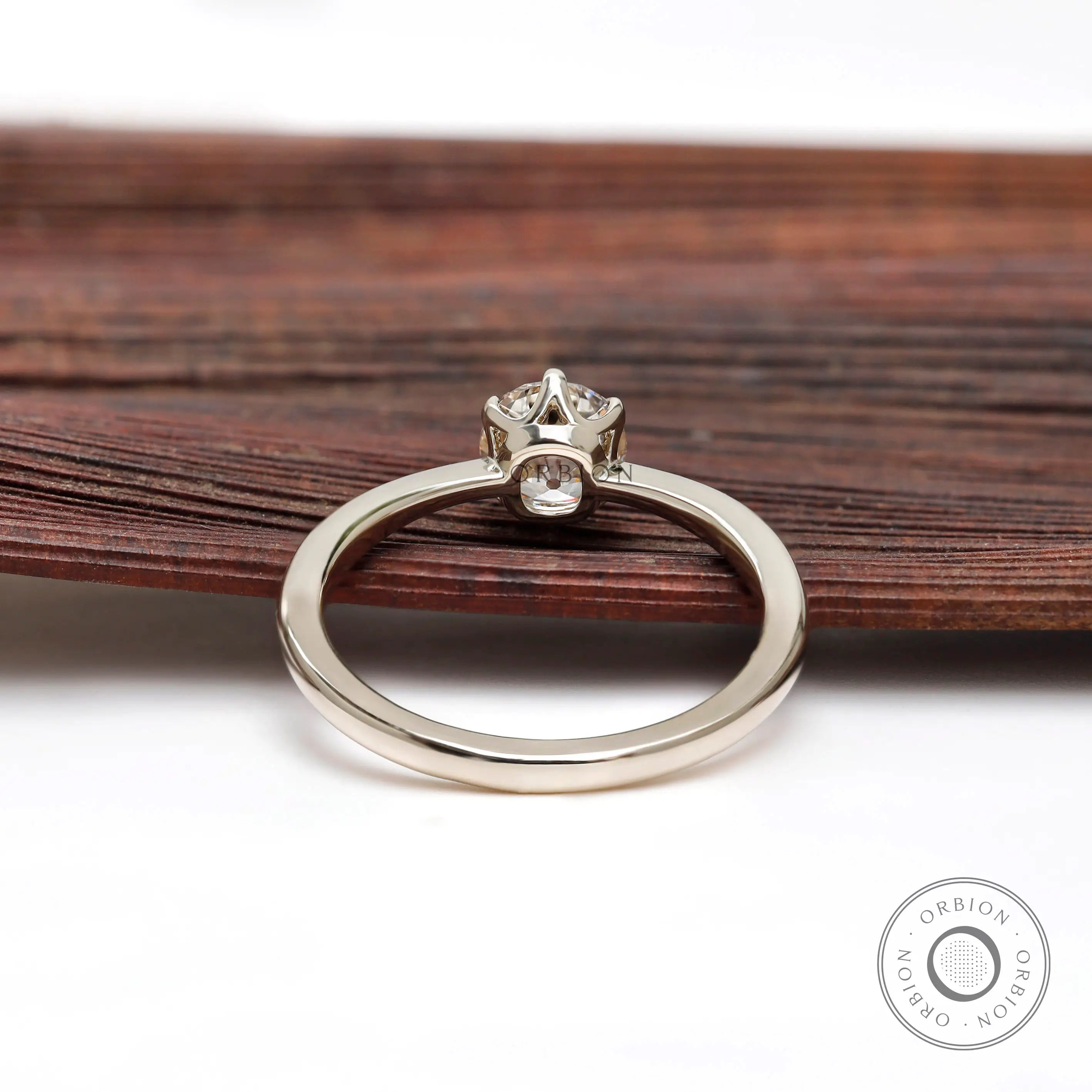 Rear gallery view of prong set elongated round diamond ring