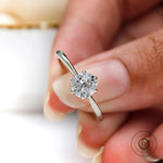 Angled view highlighting prong setting and slim band