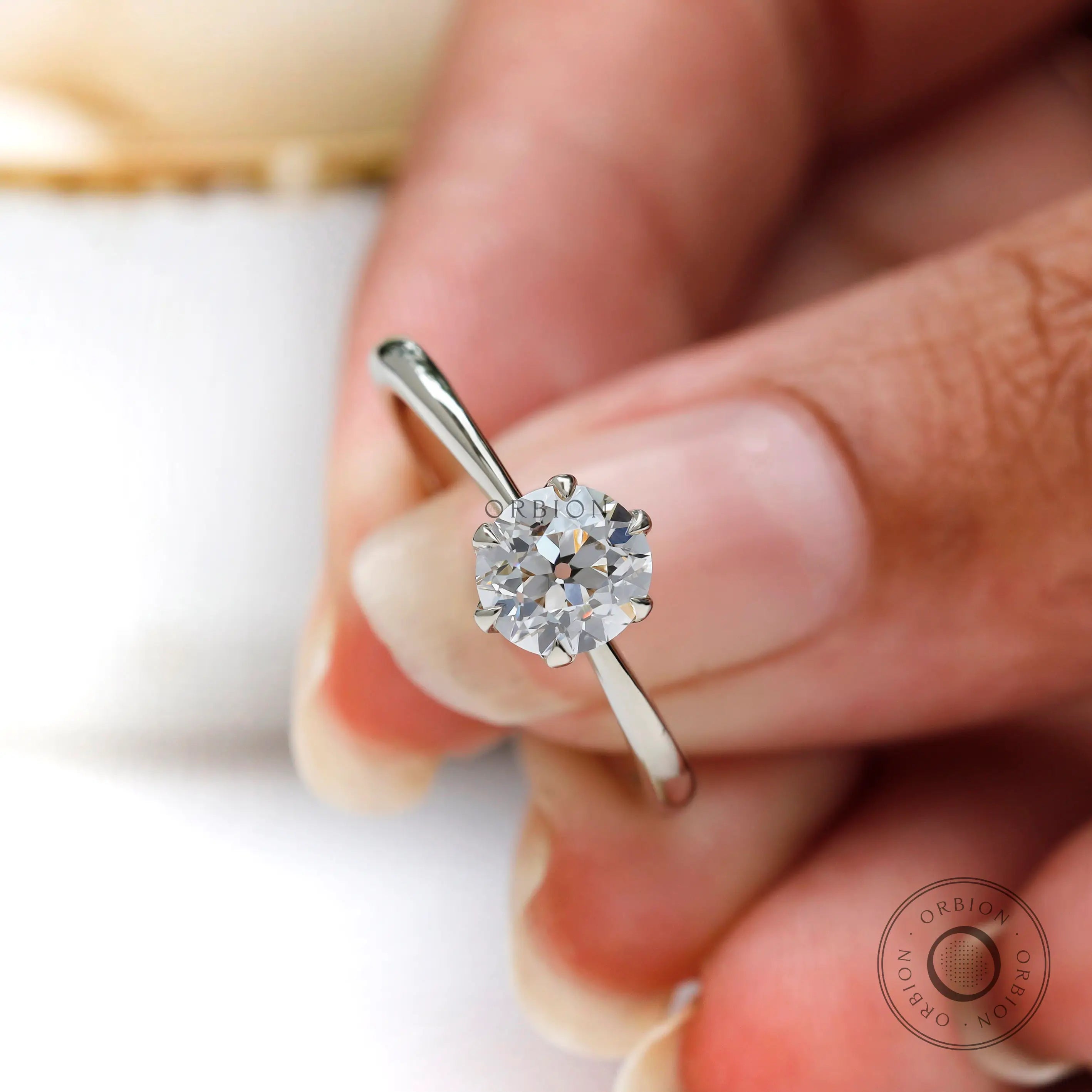 Angled view highlighting prong setting and slim band