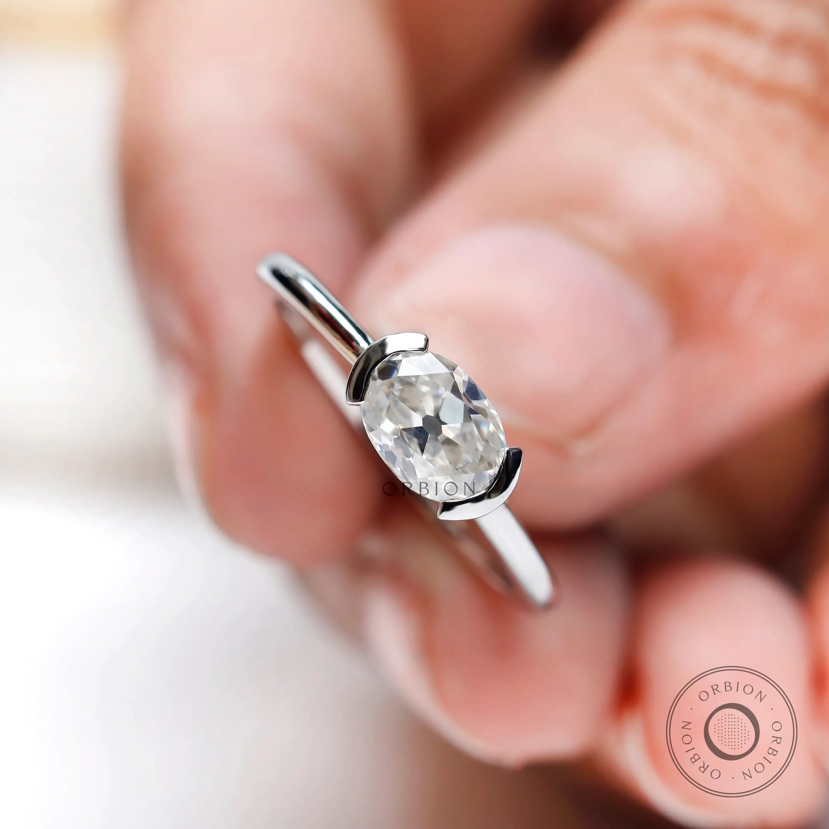 Minimalist oval moissanite dainty ring white gold top view