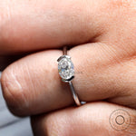 White gold oval solitaire ring with old mine cut moissanite close up