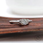 Oval old mine cut moissanite ring low profile half bezel setting