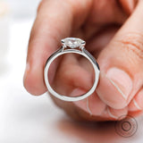 Oval old mine cut moissanite bezel set cathedral ring in 14k white gold front view