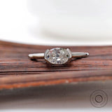 Half bezel omc oval east west engagement ring top view
