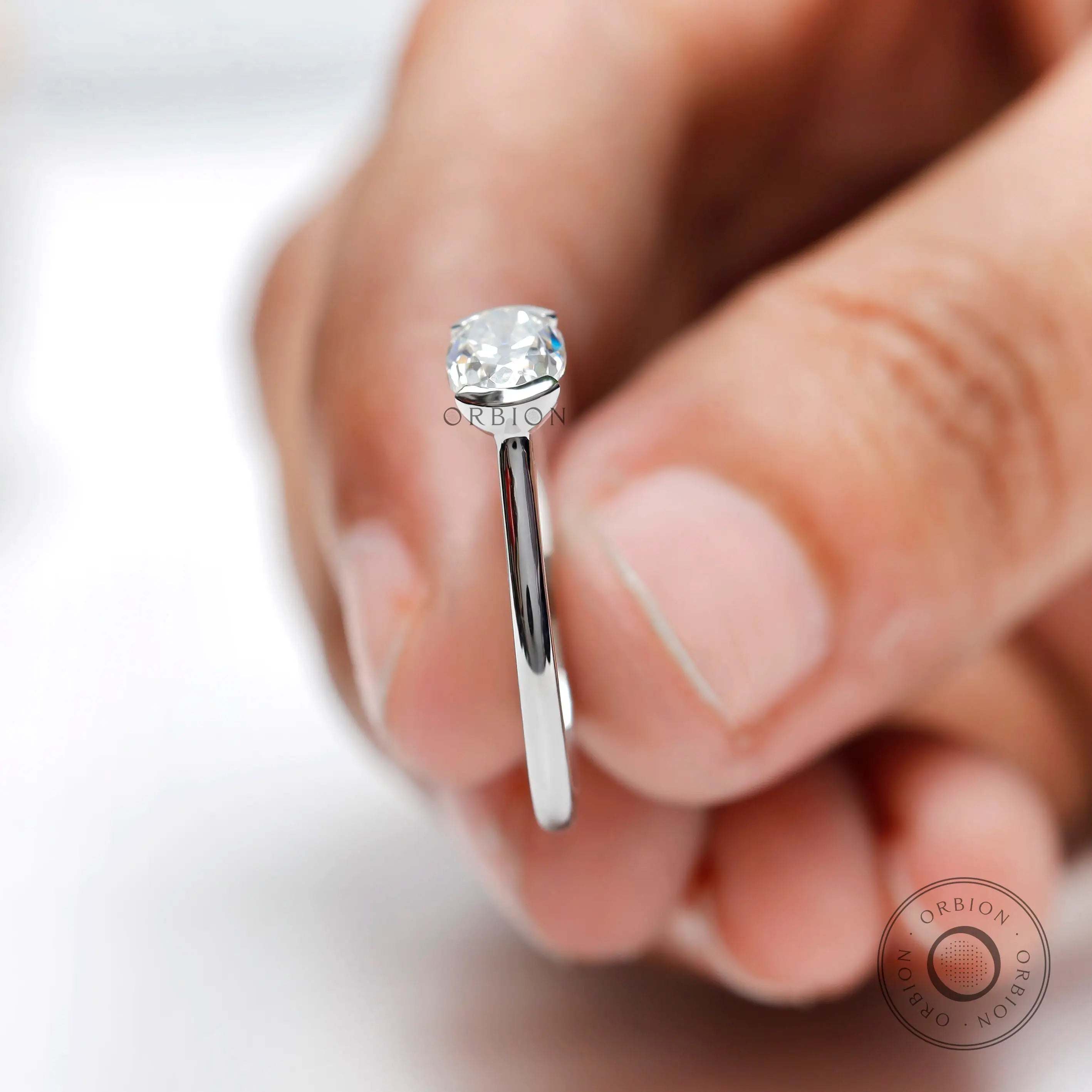 Classic oval moissanite engagement ring with sleek band