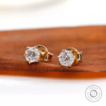 Angled view highlighting vintage cut moissanite brilliance of ear studs
