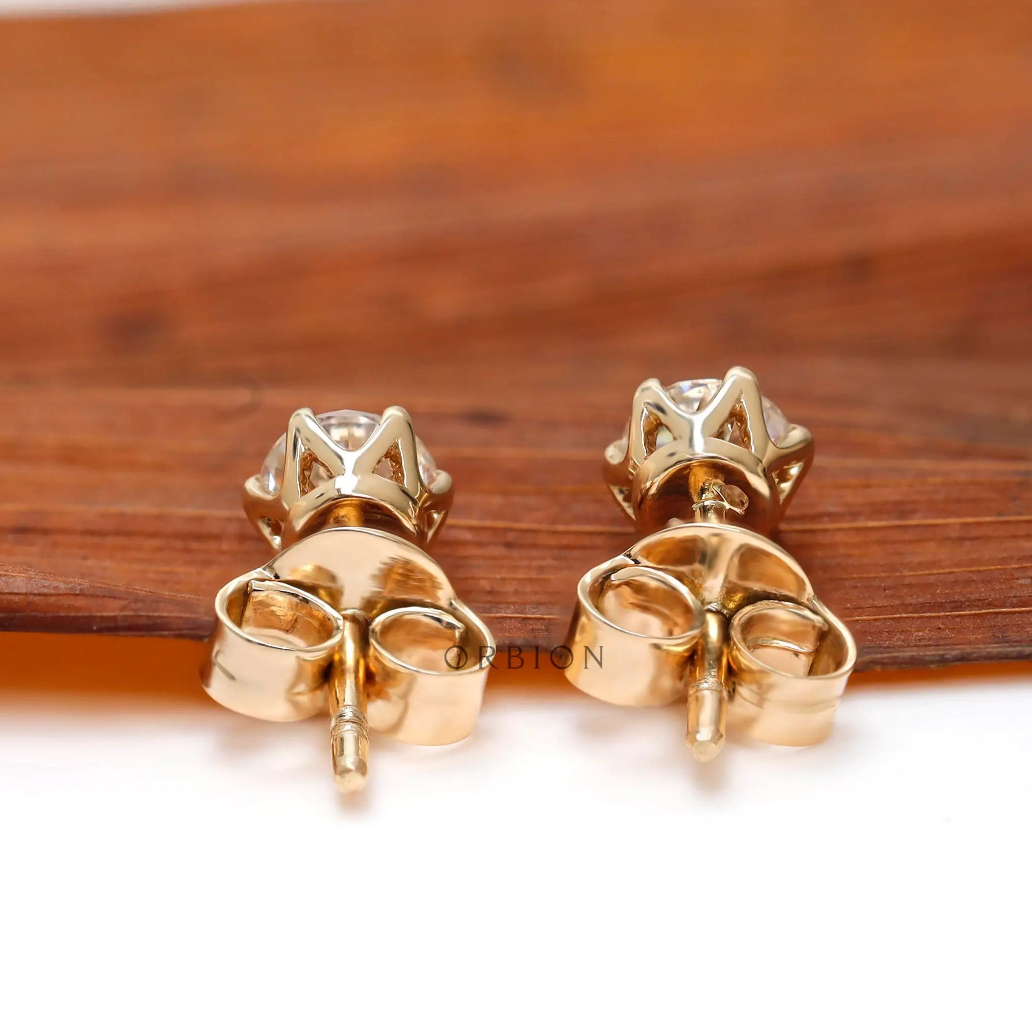 Rear view showing gold posts and butterfly backs