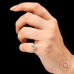 Prong setting detail of elongated cushion old mine cut solitaire ring in 14k yellow gold