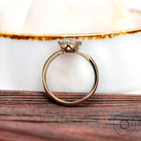 Classic engagement ring in 14k yellow gold with elongated cushion center stone