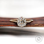 Elongated cushion old mine cut solitaire ring in 14k yellow gold front view
