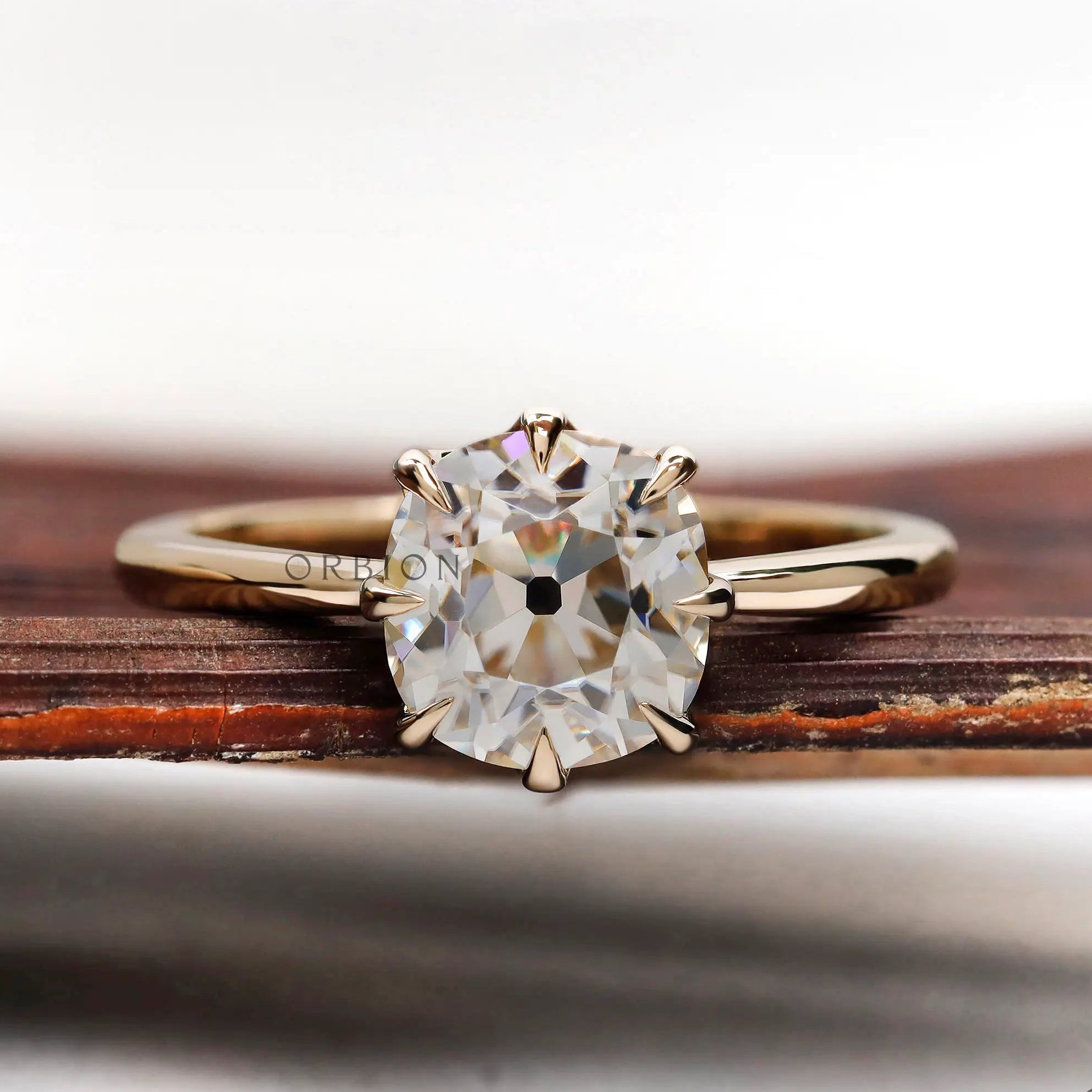 Elongated cushion old mine cut solitaire ring in 14k yellow gold front view