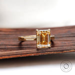 Side view emerald champagne moissanite ring 14k yellow gold