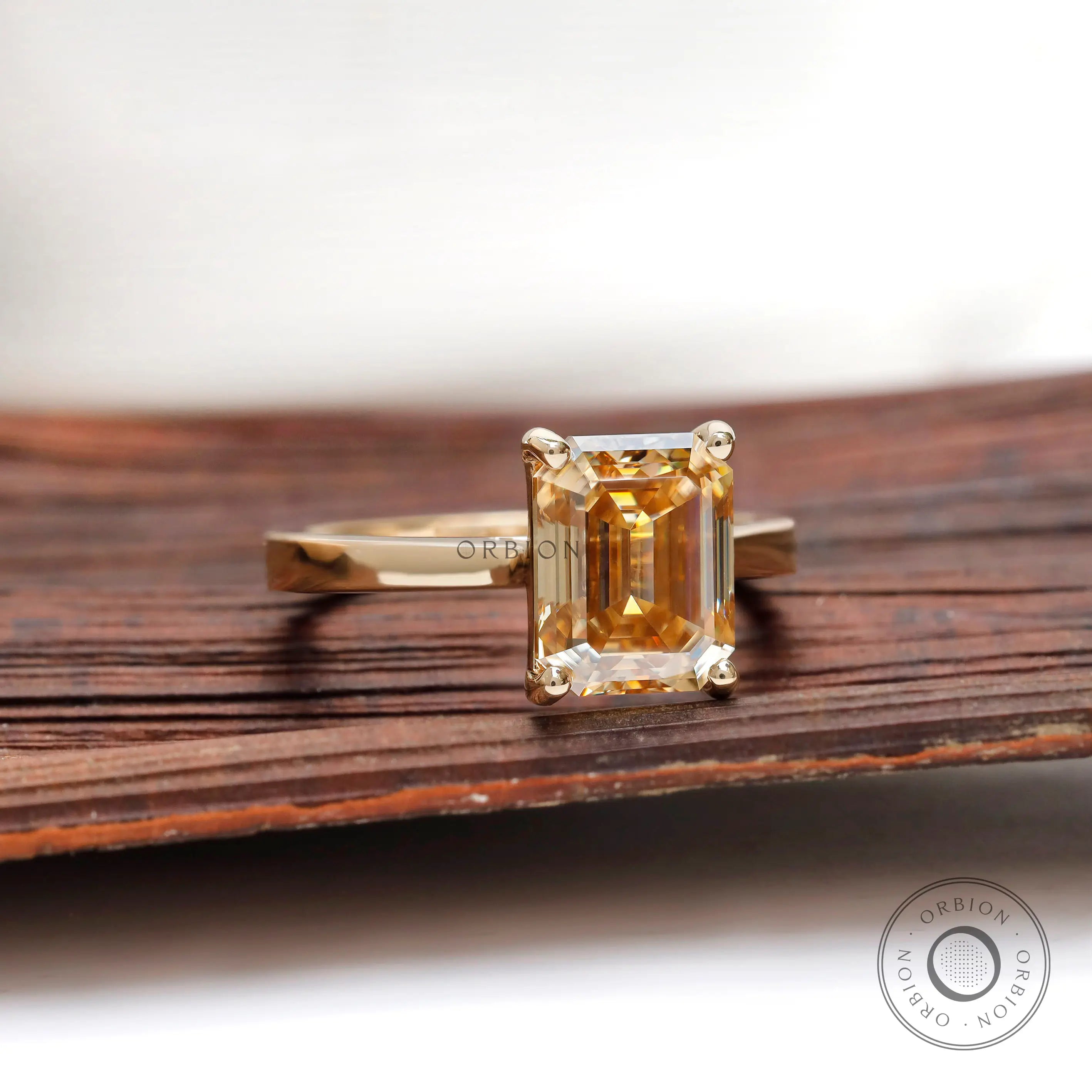 Side view emerald champagne moissanite ring 14k yellow gold