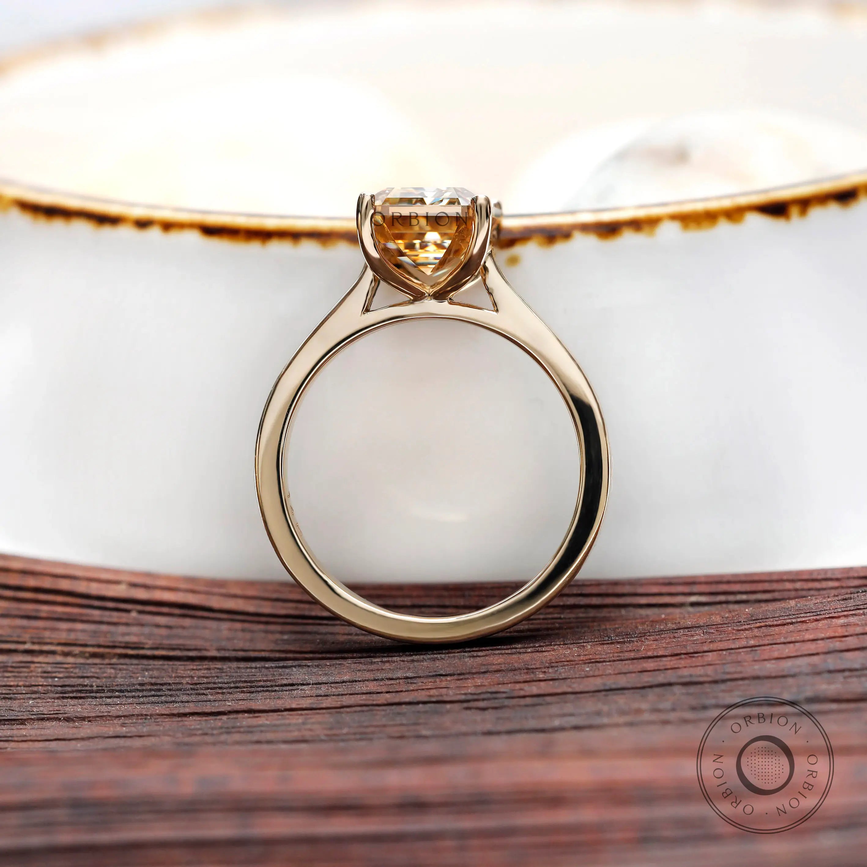 Cathedral shank handcrafted emerald cut champagne moissanite ring