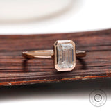 Bezel set emerald cut lab diamond ring