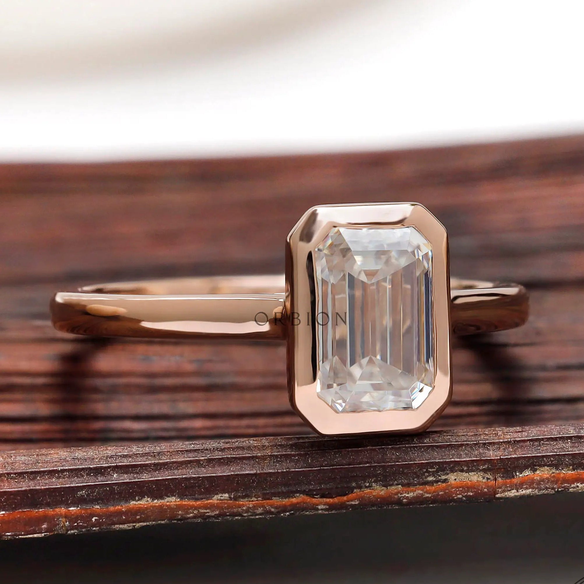 Bezel set emerald cut lab diamond ring