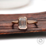 Rose gold emerald cut solitaire ring front view