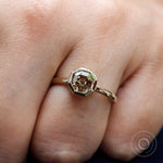 Step cut champagne moissanite octagon engagement ring close up