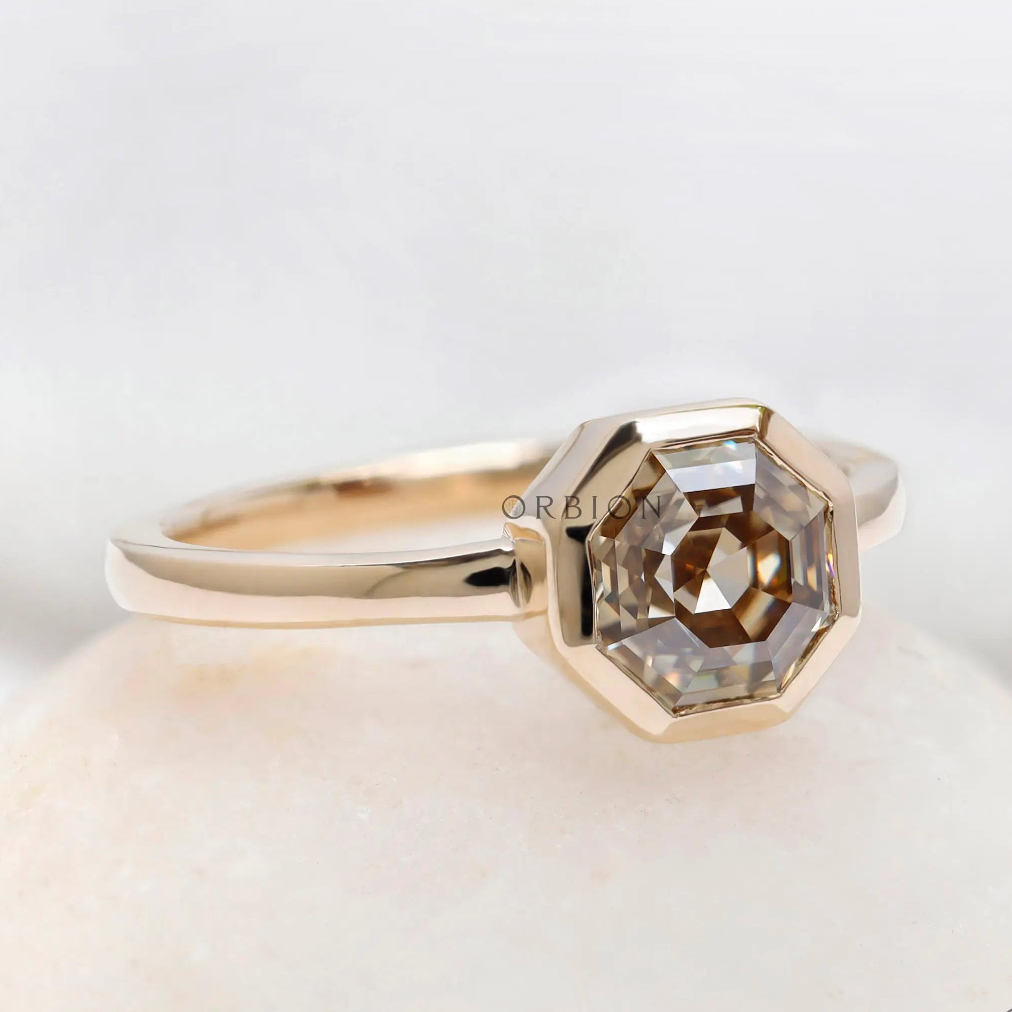 Octagon asscher dark champagne moissanite bezel set engagement ring in yellow gold