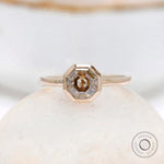 Minimalist octagon moissanite engagement ring with champagne stone close up