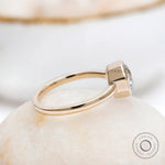Bezel set champagne moissanite solitaire ring in polished yellow gold
