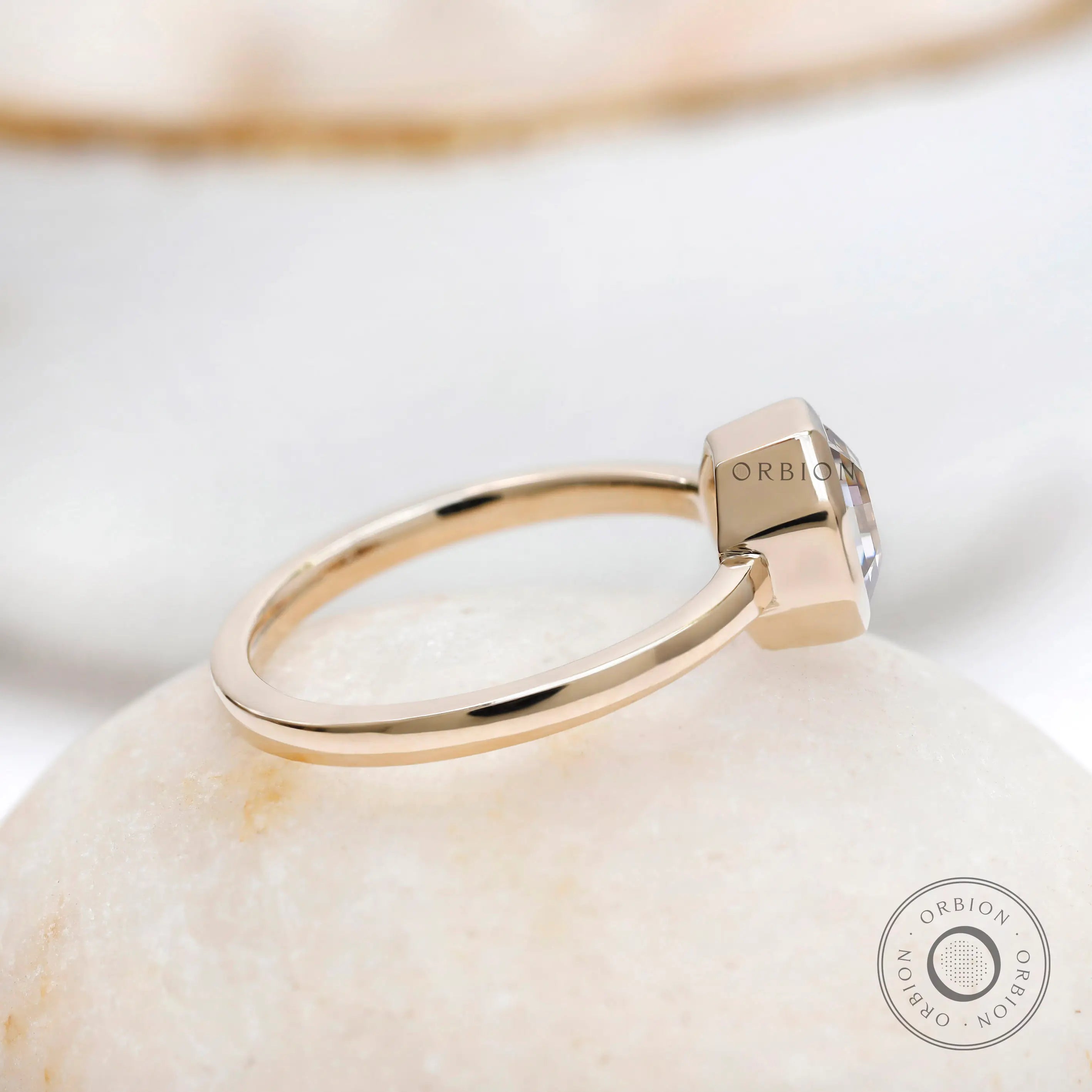 Bezel set champagne moissanite solitaire ring in polished yellow gold