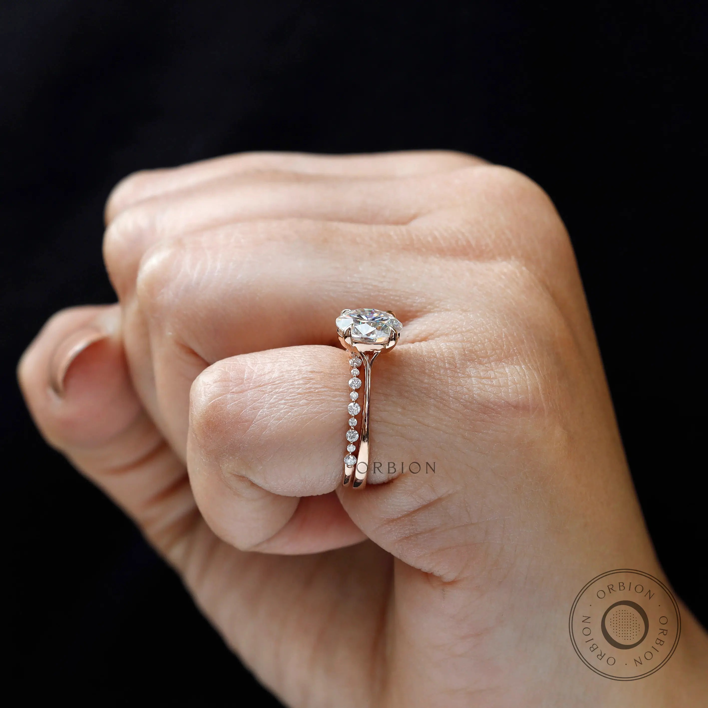 Hand worn round moissanite engagement ring rose gold