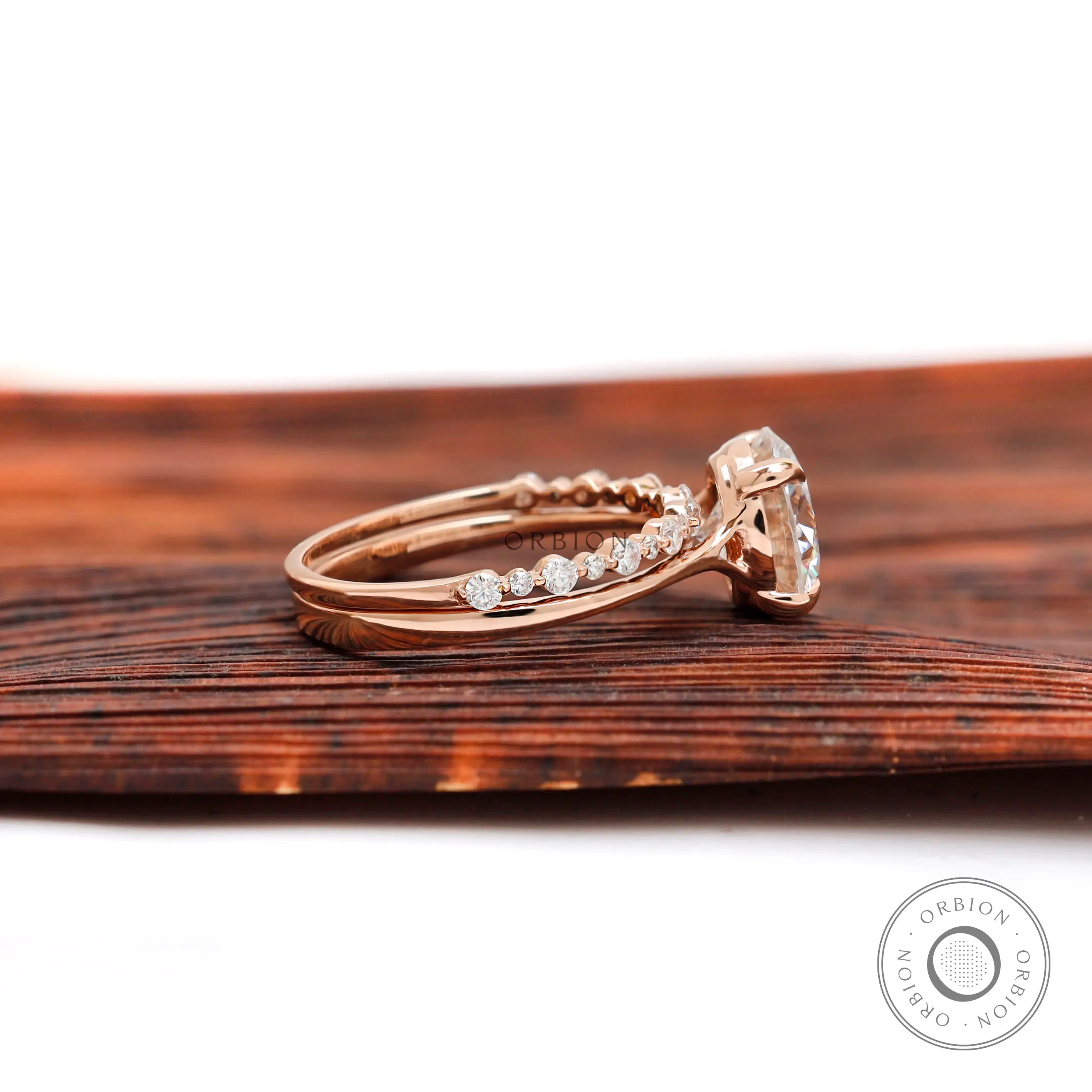 Side profile cathedral engagement ring rose gold
