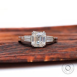 Asscher cut moissanite engagement ring with tapered baguette side stones