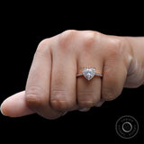 14k Rose Gold Heart Shaped Halo Moissanite Ring On Fingure