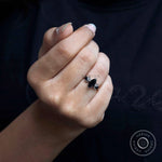 Black marquise three stone moissanite ring glossy finish on fingure