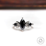 Black marquise moissanite three stone engagement ring 10K white gold front view