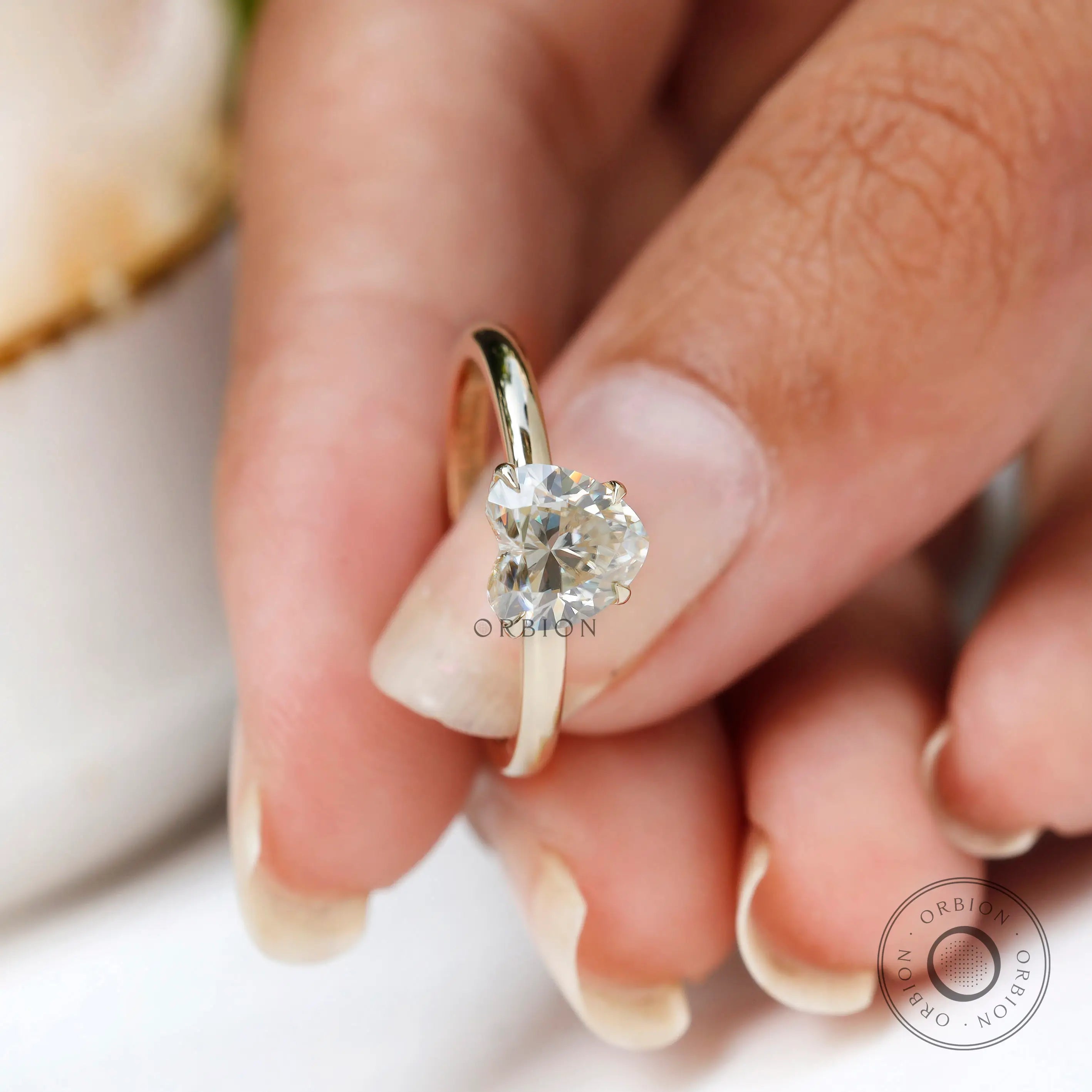 Macro front close up heart solitaire ring with blurred background