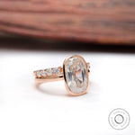 Angled view of elongated cushion moissanite ring with side stones