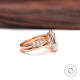 Side profile of bezel set moissanite ring in 10K rose gold