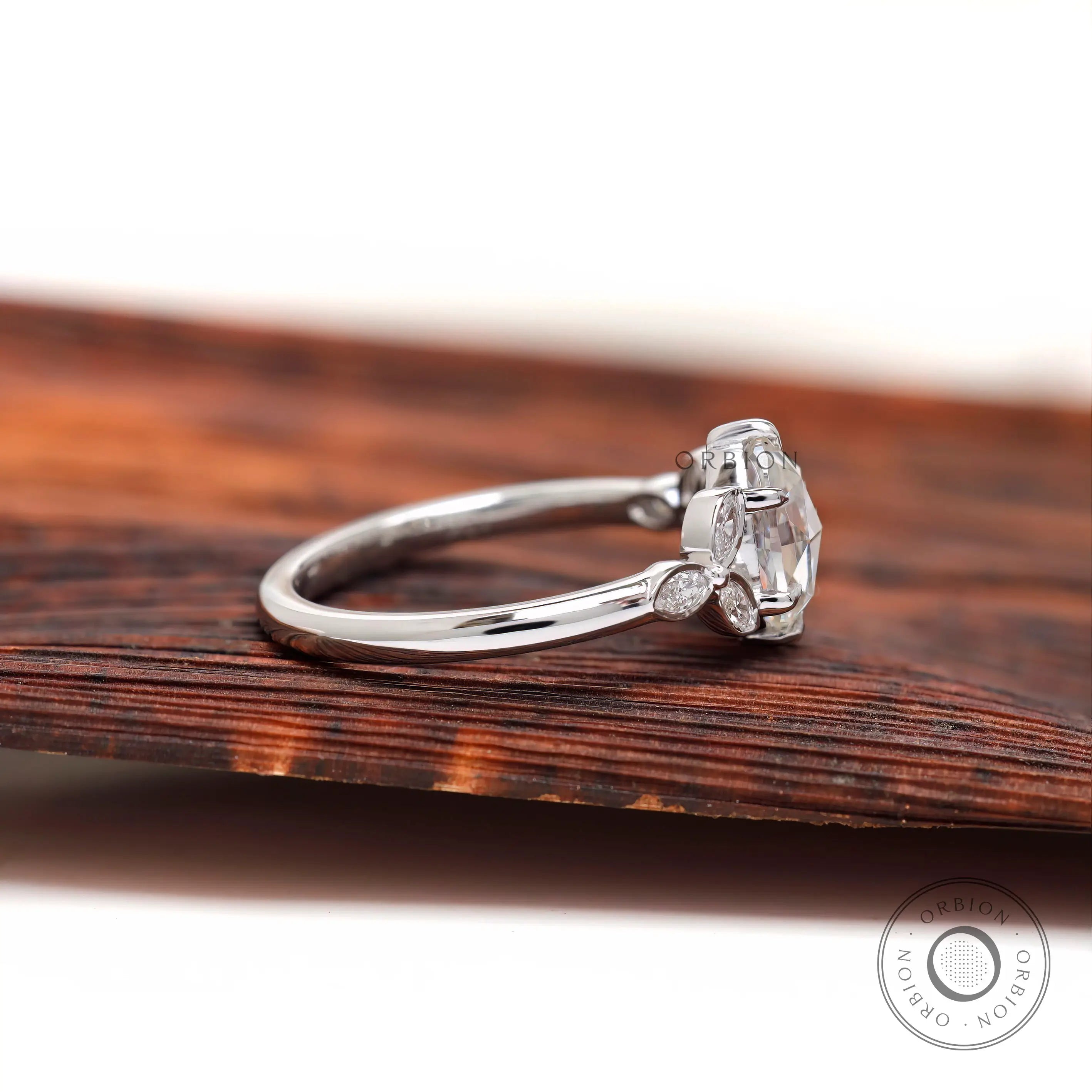 Side profile view marquise diamond cluster accents