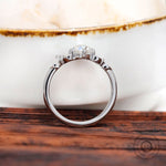 Rear view elevated oval moissanite cluster setting