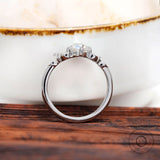 Rear view elevated oval moissanite cluster setting